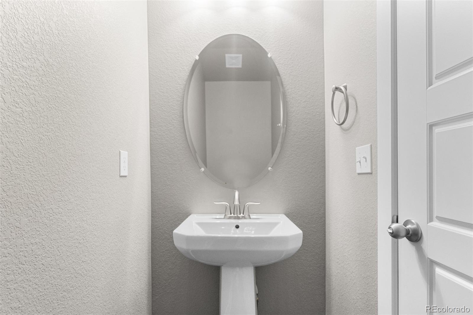11918 Mountview Lane Broomfield, CO 80021 - Photo 29 of 32 a bathroom with a sink and a mirror