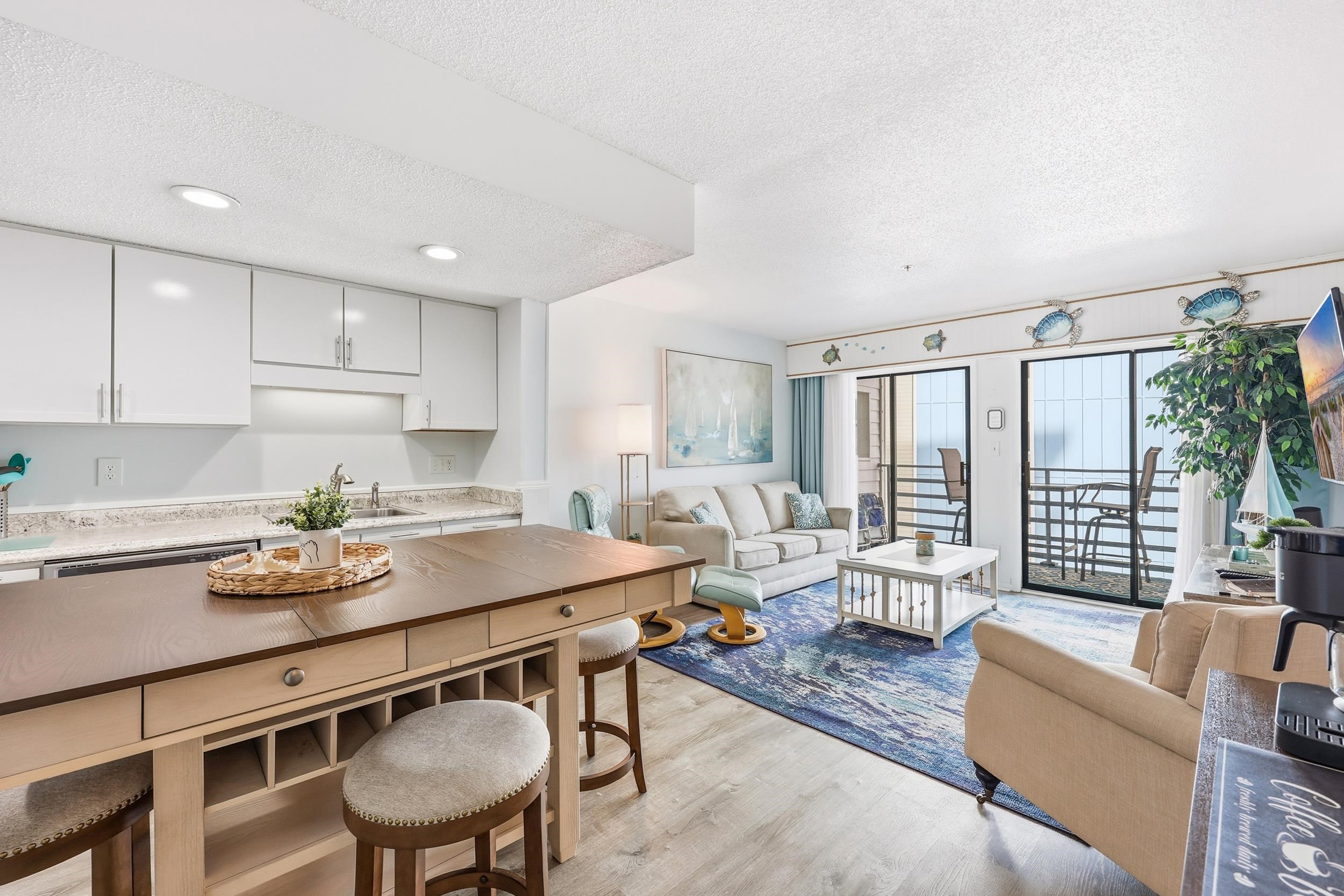 920 North Waccamaw Drive, Unit 2305 Murrells Inlet, SC 29576 - Photo 10 of 40 Living room featuring a textured ceiling and light wood-style flooring