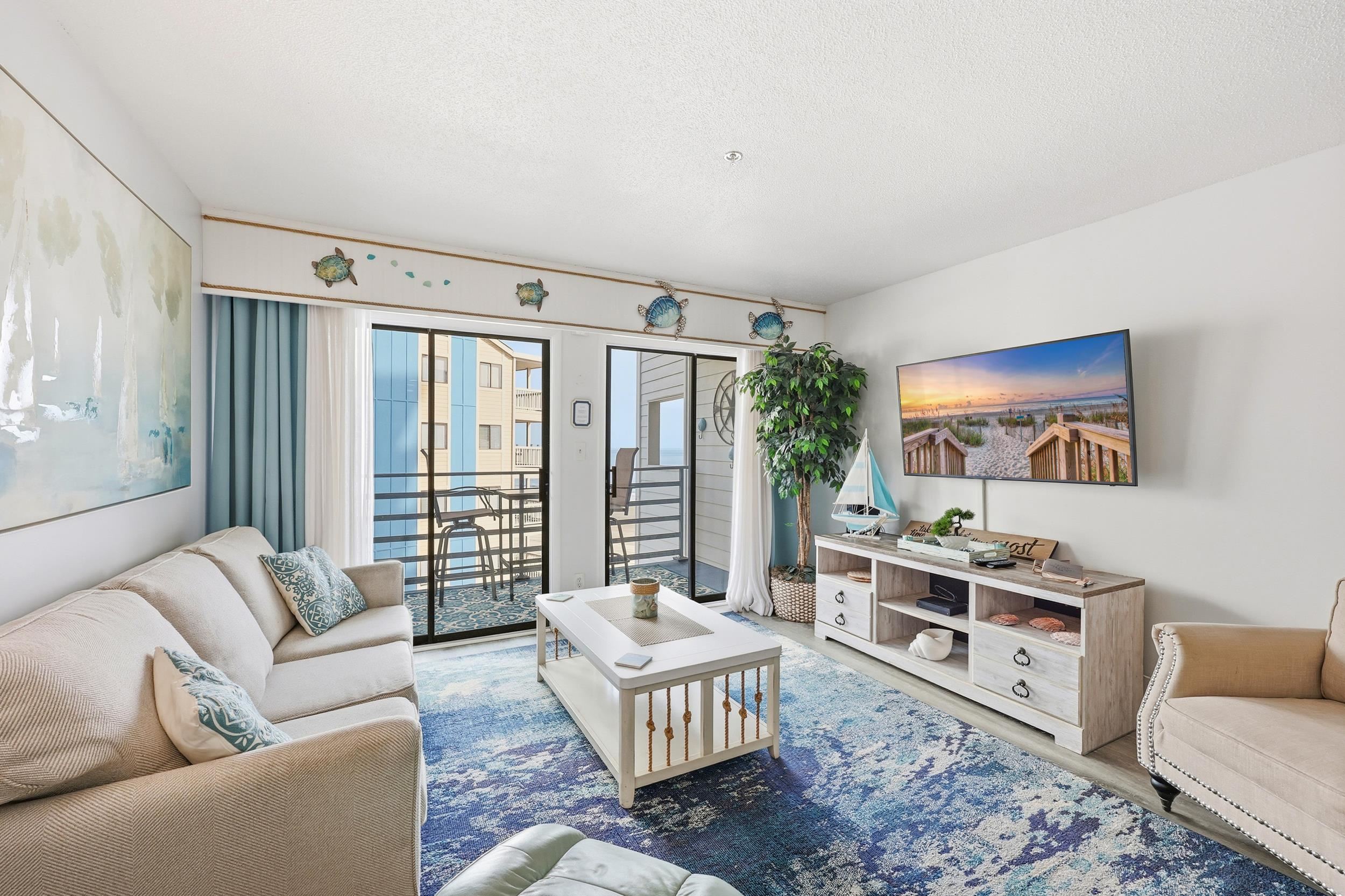920 North Waccamaw Drive, Unit 2305 Murrells Inlet, SC 29576 - Photo 16 of 40 Living area with wood finished floors and a textured ceiling