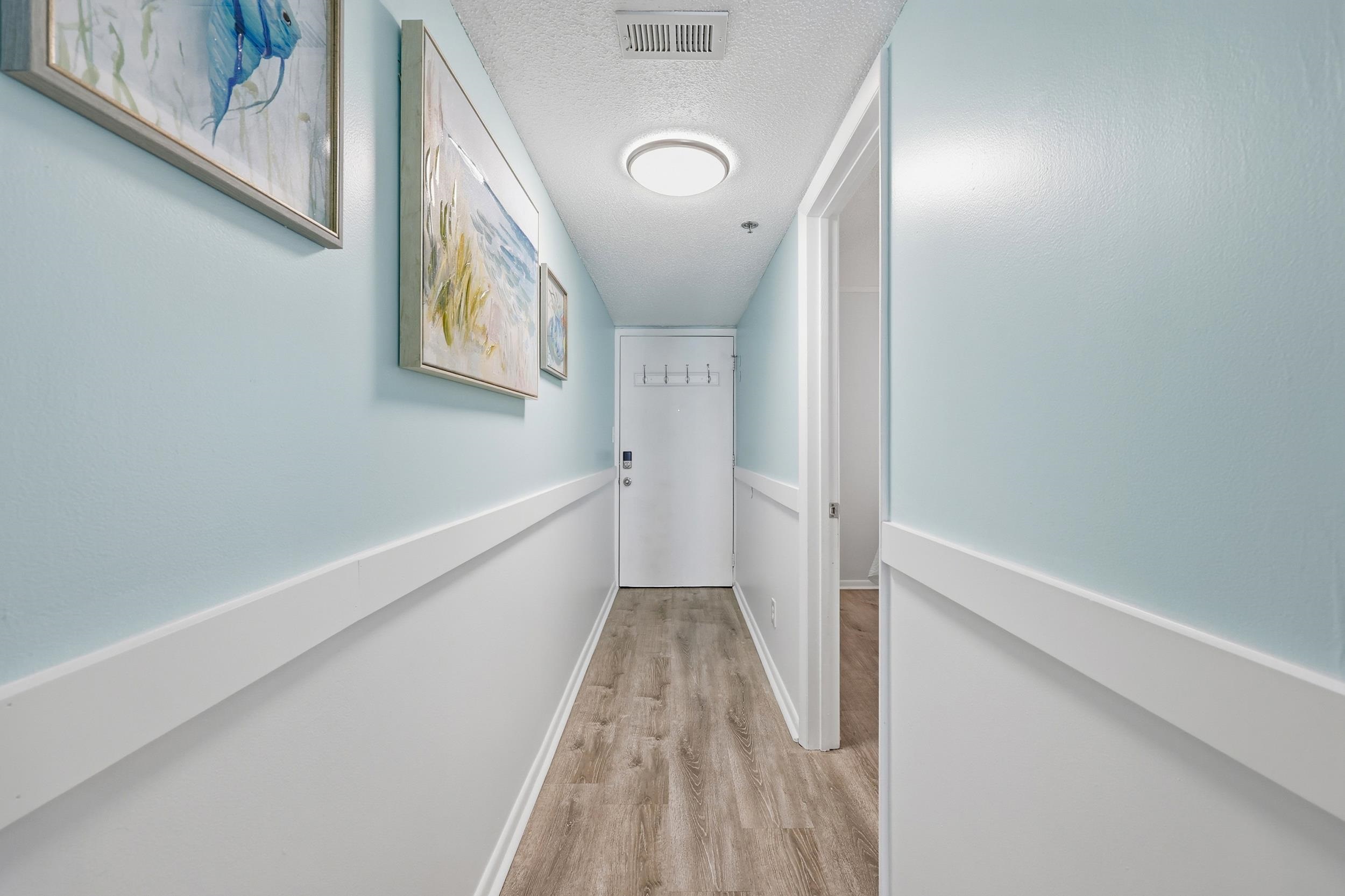 920 North Waccamaw Drive, Unit 2305 Murrells Inlet, SC 29576 - Photo 2 of 40 Hall with a textured ceiling and light wood finished floors