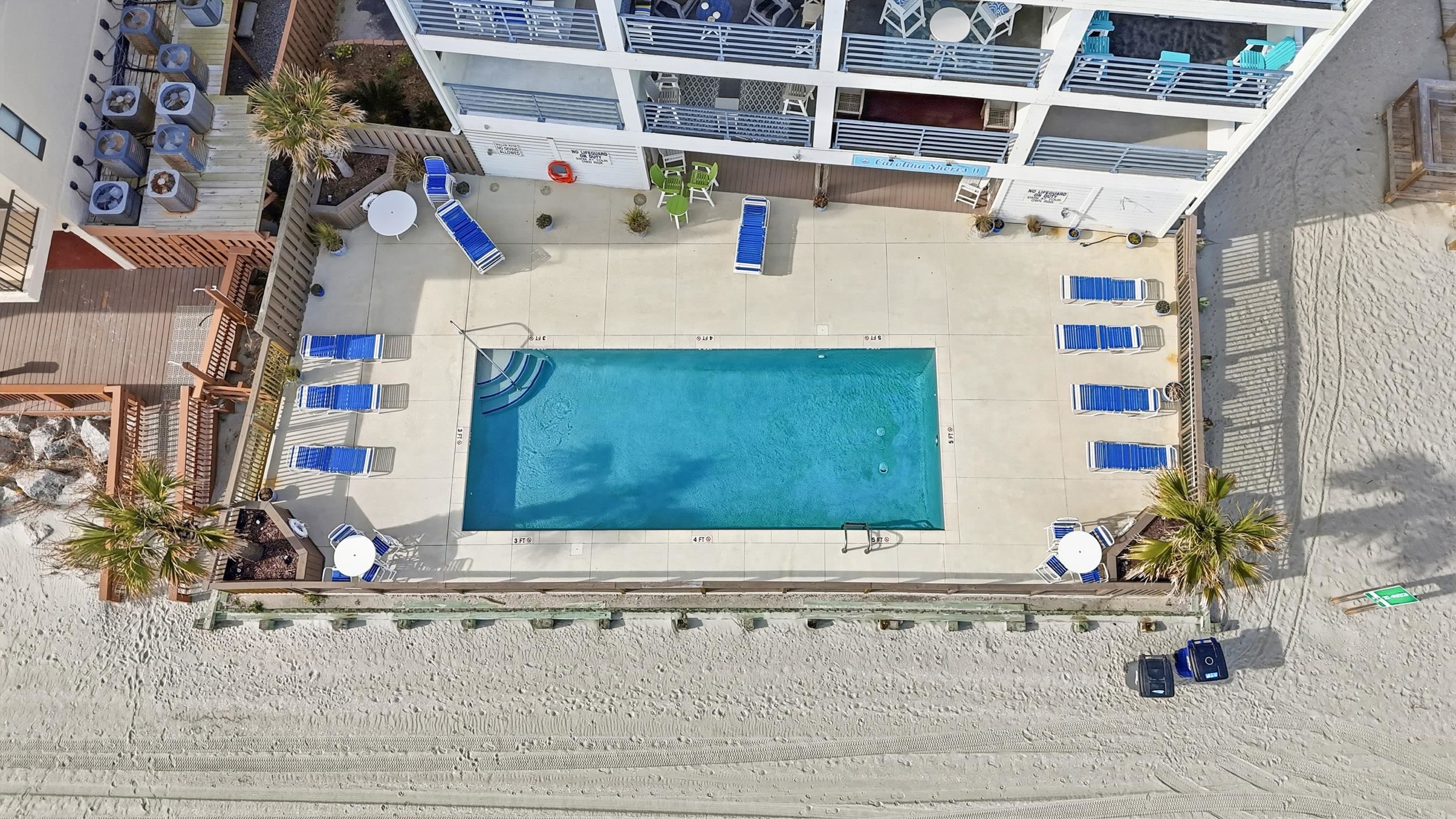 920 North Waccamaw Drive, Unit 2305 Murrells Inlet, SC 29576 - Photo 33 of 40 Drone / aerial view of a pool