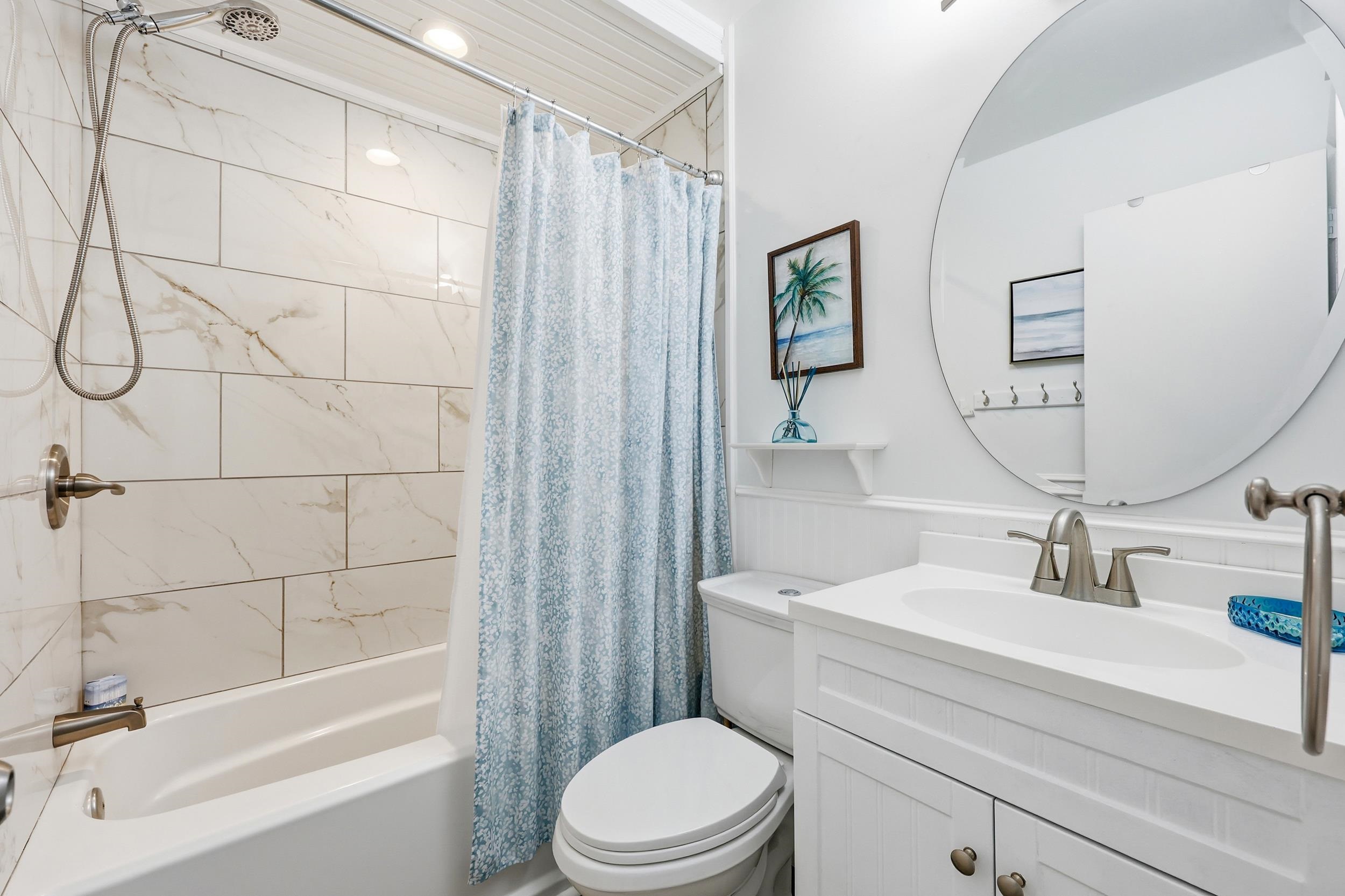 920 North Waccamaw Drive, Unit 2305 Murrells Inlet, SC 29576 - Photo 7 of 40 Full bathroom featuring vanity, shower / bathtub combination with curtain, and wainscoting
