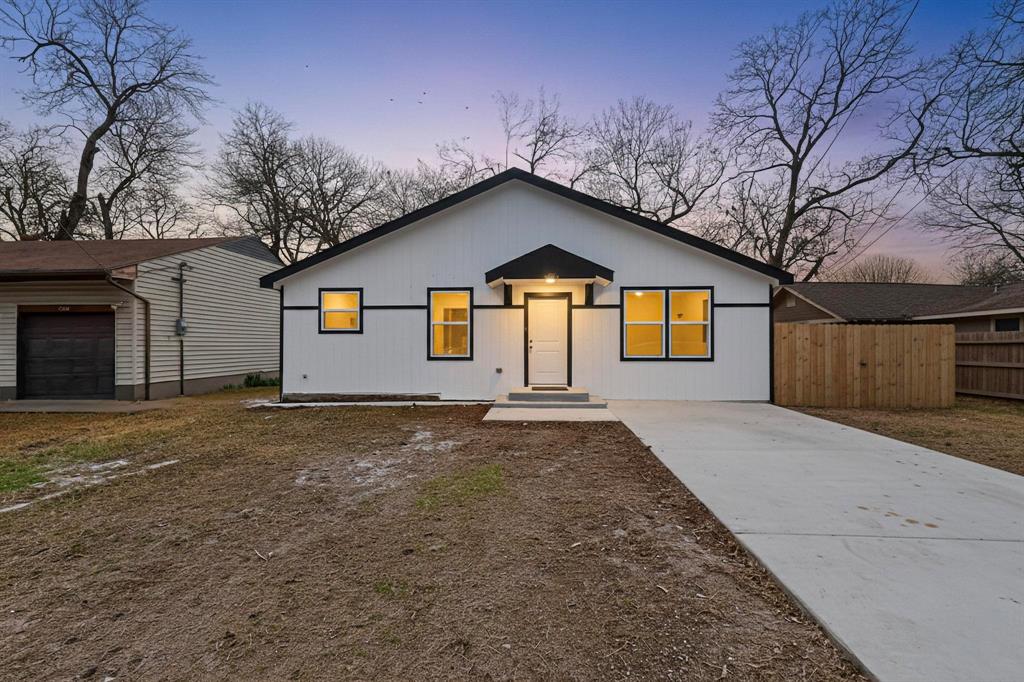 5650 Forney Road Dallas, TX 75227 - Photo 2 of 39 a view of a house with a yard and garage