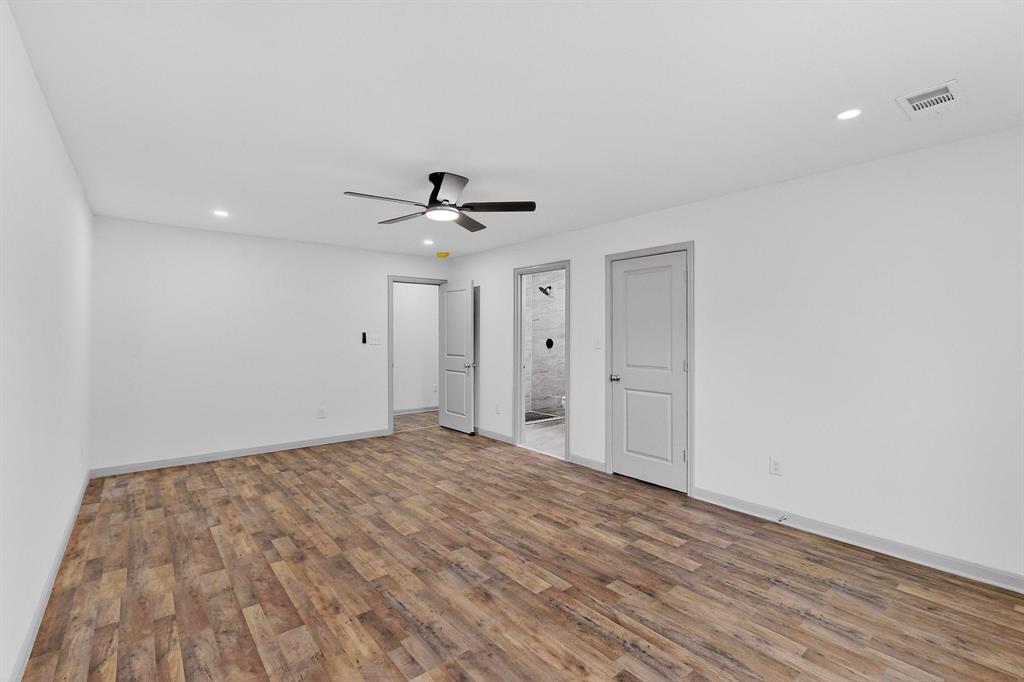 5650 Forney Road Dallas, TX 75227 - Photo 23 of 39 a view of empty room with wooden floor
