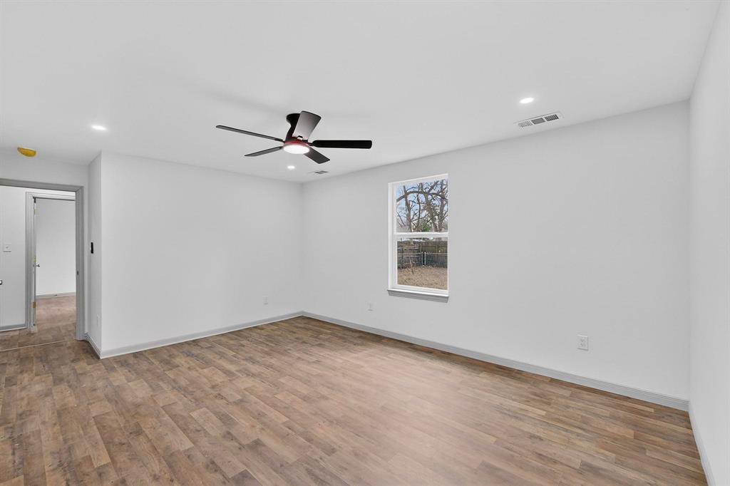 5650 Forney Road Dallas, TX 75227 - Photo 30 of 39 a view of a livingroom with a ceiling fan and window