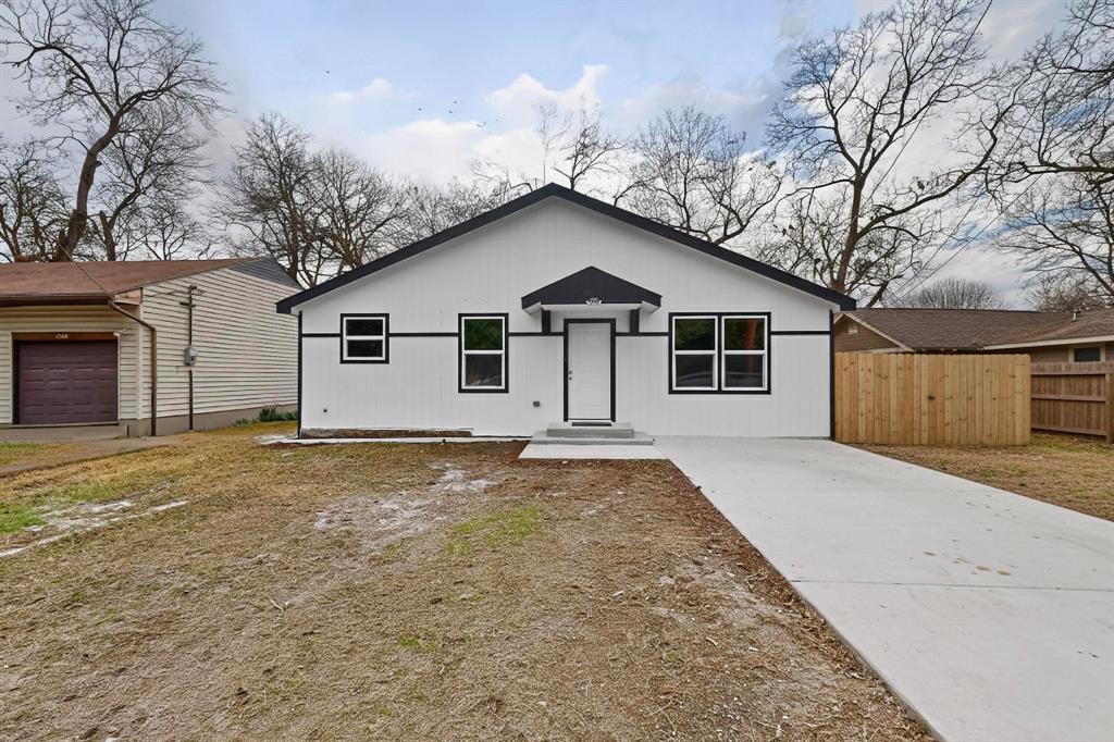 5650 Forney Road Dallas, TX 75227 - Photo 3 of 39 a view of a house with a yard and garage