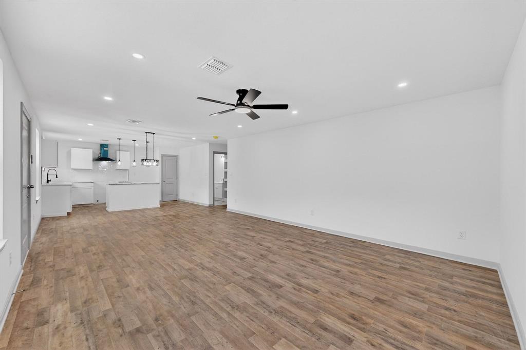 5650 Forney Road Dallas, TX 75227 - Photo 9 of 39 a view of a kitchen with a sink and a refrigerator