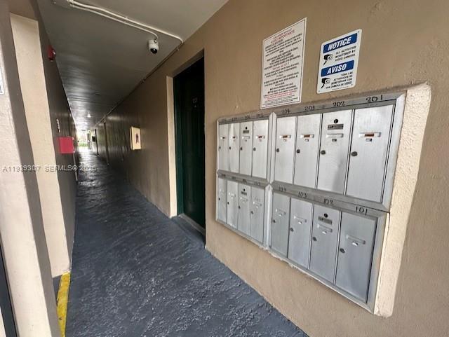 1015 Northwest 45th Avenue, Unit 101 Miami, FL 33126 - Photo 11 of 17 a view of a hallway with wooden floor