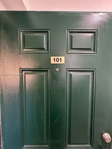 a bathroom with a shower and a mirror