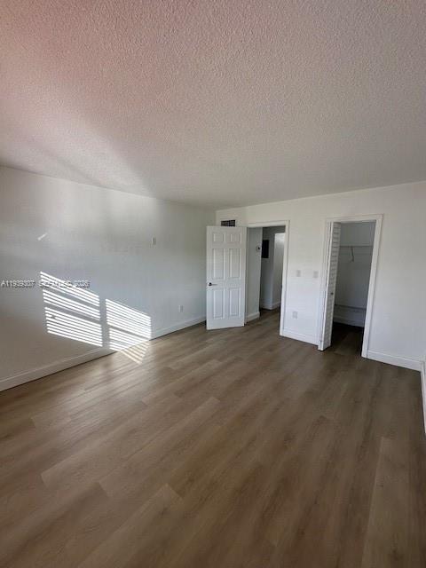 1015 Northwest 45th Avenue, Unit 101 Miami, FL 33126 - Photo 7 of 17 a view of empty room with wooden floor