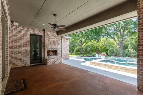 a view of a living room and floor to ceiling windows