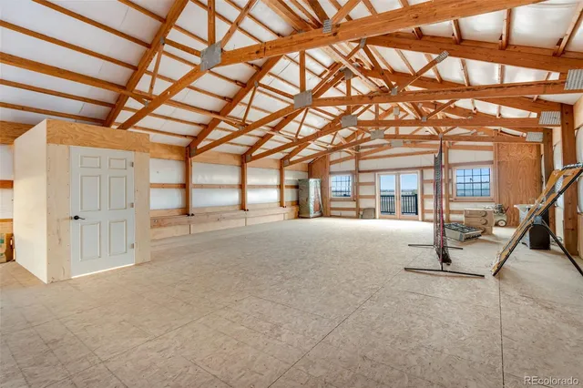 a view of a balcony with wooden floor