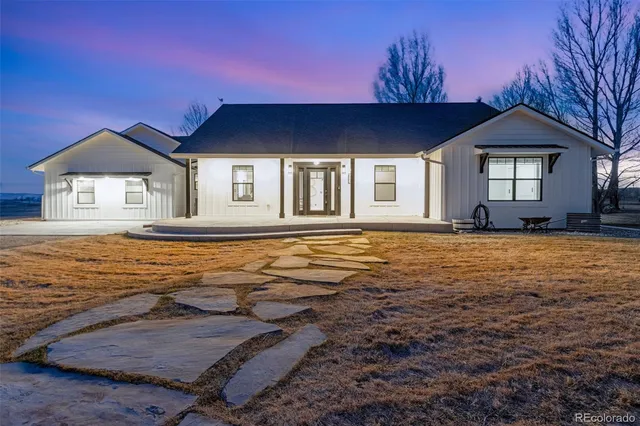 a view of a house with yard and tree s