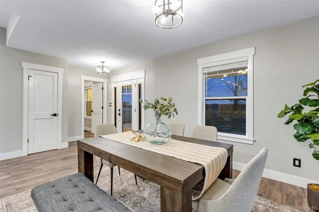 a large white kitchen with a large window