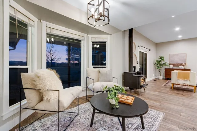 a outdoor living room with furniture and a window