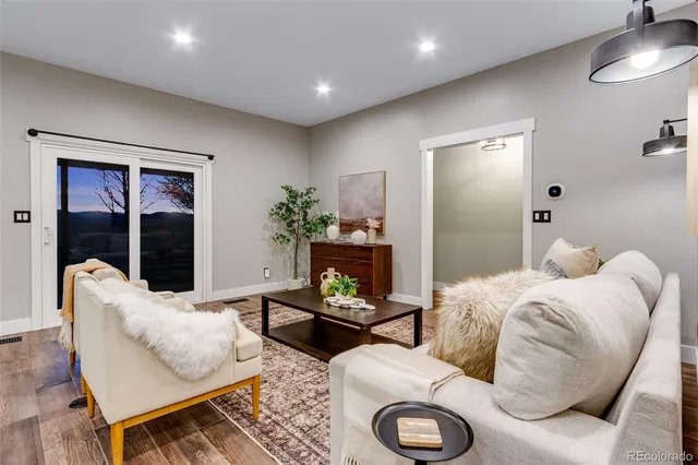 a bedroom with a large bed and a mirror