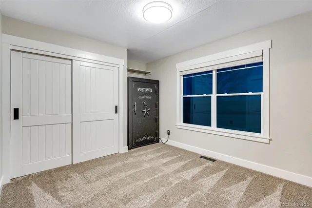 a view of a hallway with washer and dryer