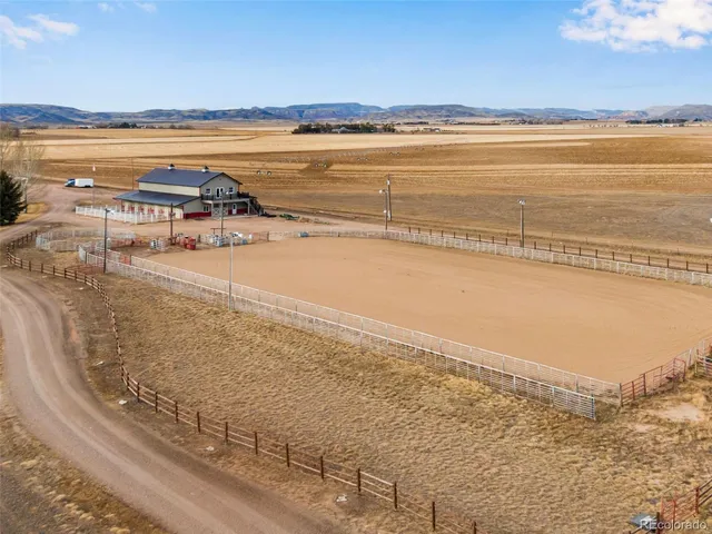 a view of a house with yard and ocean view
