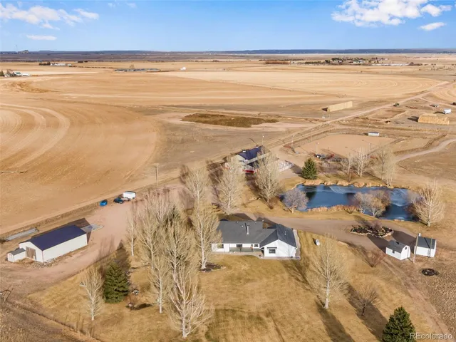 an aerial view of a golf course with a big yard