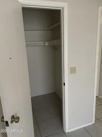 a view of an empty walk in closet