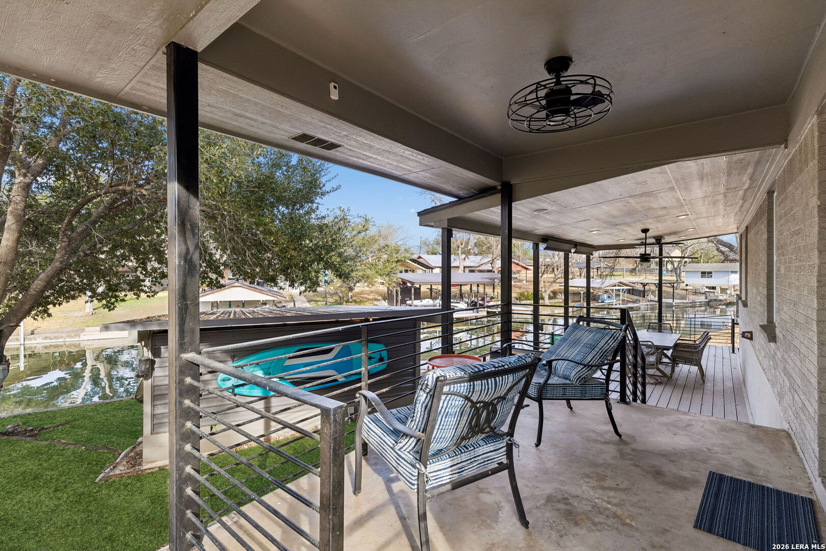 119 Robin Road Highland Haven, TX 78654 - Photo 11 of 33 a roof deck with table and chairs