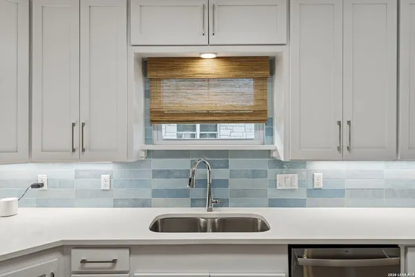 a kitchen with a sink and a window