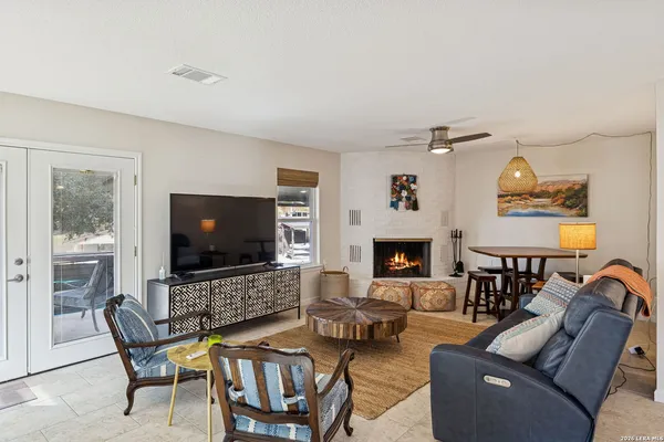 a dining room with furniture and a fireplace