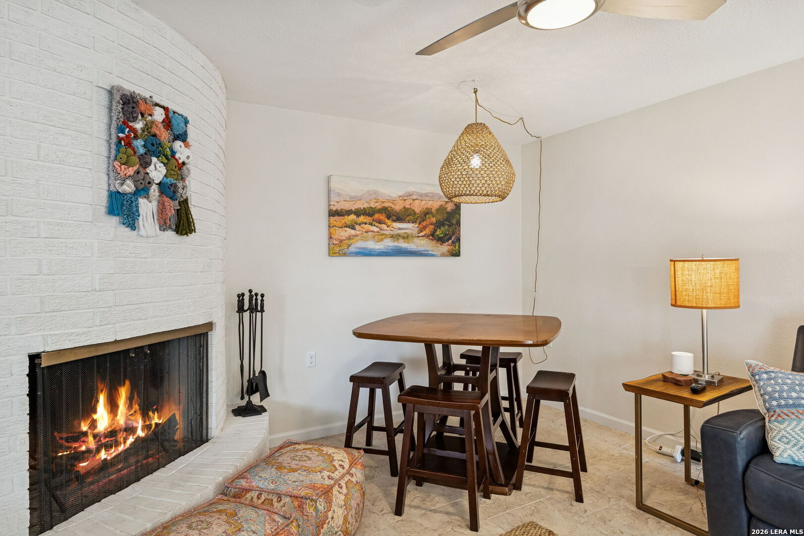 119 Robin Road Highland Haven, TX 78654 - Photo 21 of 33 a dining room with furniture and a fireplace