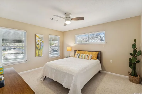 a bedroom with a bed and window
