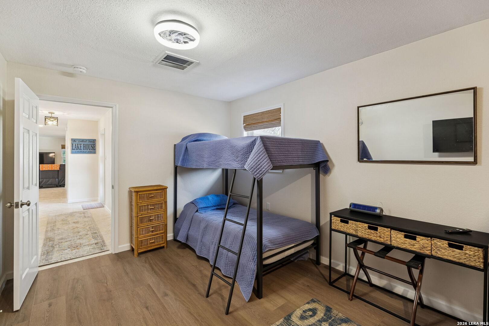 119 Robin Road Highland Haven, TX 78654 - Photo 28 of 33 a bedroom with a bed and a tv on the dresser