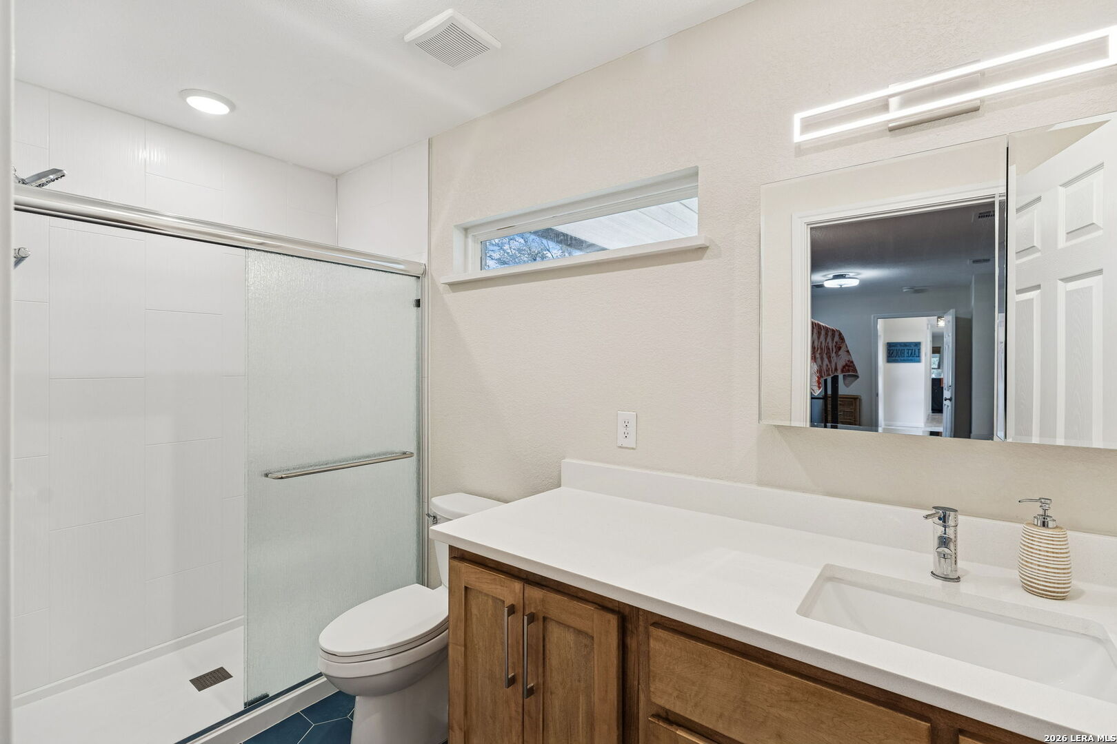119 Robin Road Highland Haven, TX 78654 - Photo 29 of 33 a bathroom with a sink a toilet and shower