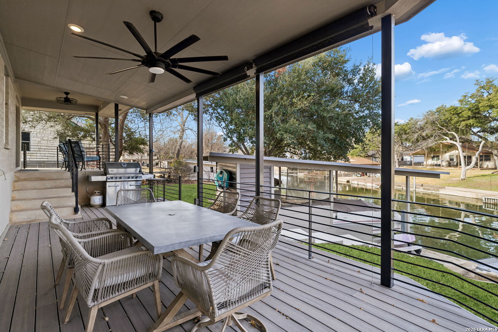 119 Robin Road Highland Haven, TX 78654 - Photo 9 of 33 a view of a patio with a table chairs and a table