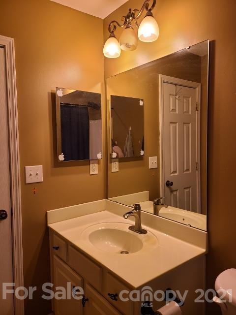 205 Butler Place Fort Mill, SC 29715 - Photo 11 of 13 a bathroom with a sink vanity and a mirror