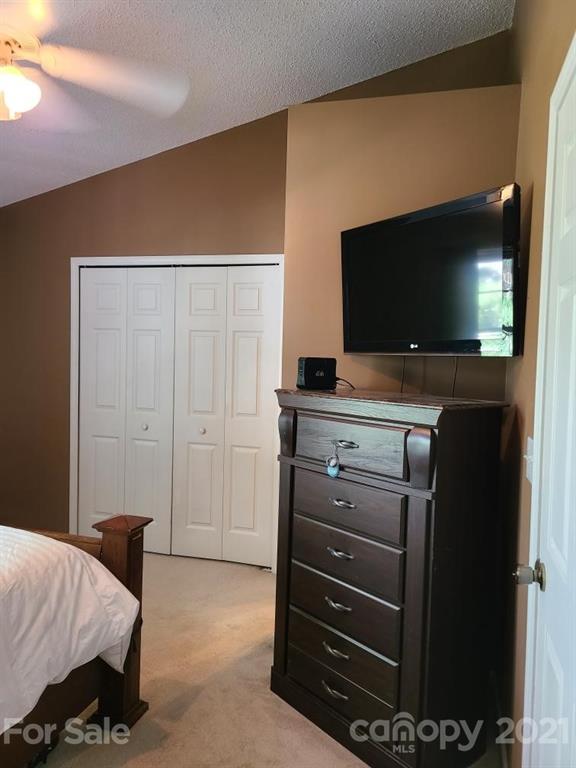 205 Butler Place Fort Mill, SC 29715 - Photo 12 of 13 a bedroom with a bed and television