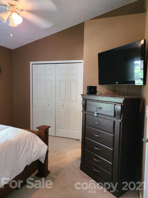 205 Butler Place Fort Mill, SC 29715 - Photo 13 of 13 a bedroom with a bed and a flat screen tv