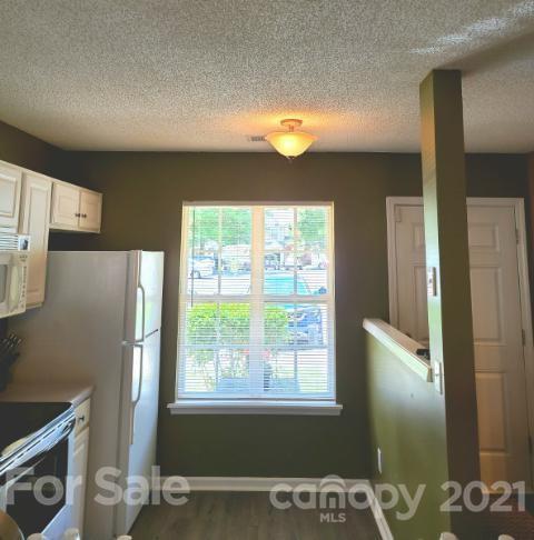 205 Butler Place Fort Mill, SC 29715 - Photo 7 of 13 a view of a refrigerator in kitchen and a window