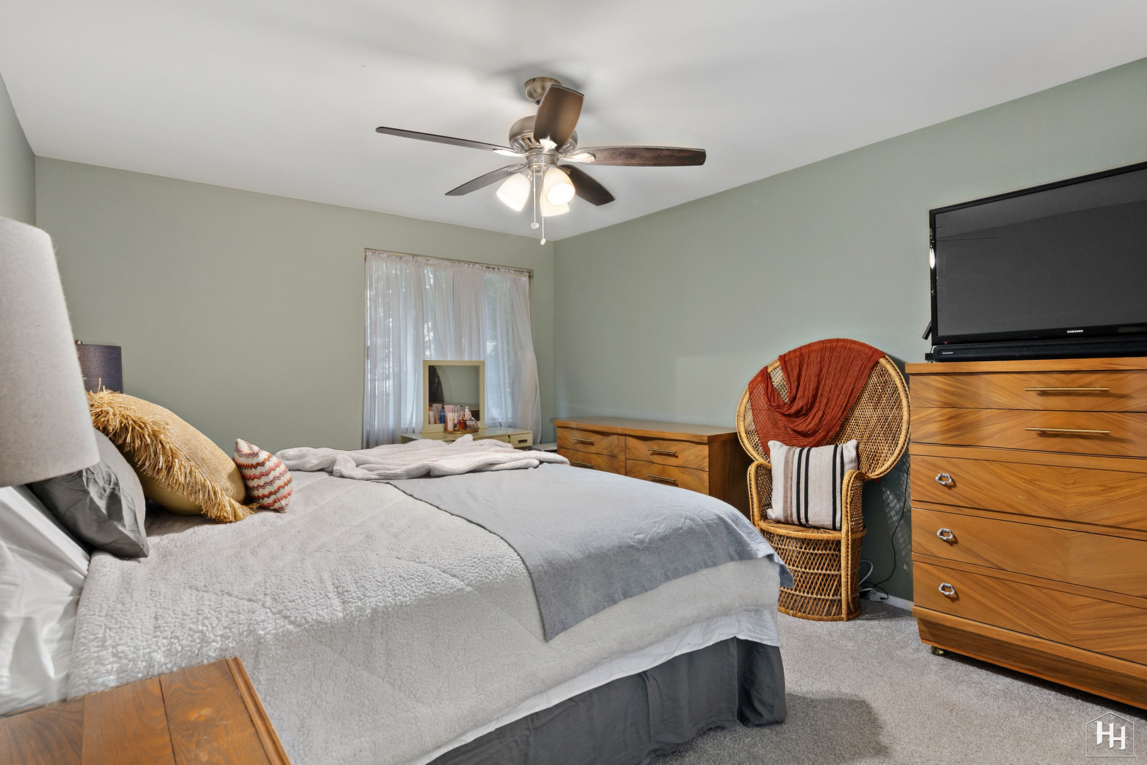 940 East Old Willow Road, Unit 206 Prospect Heights, IL 60070 - Photo 12 of 25 a bedroom with a bed and a chandelier