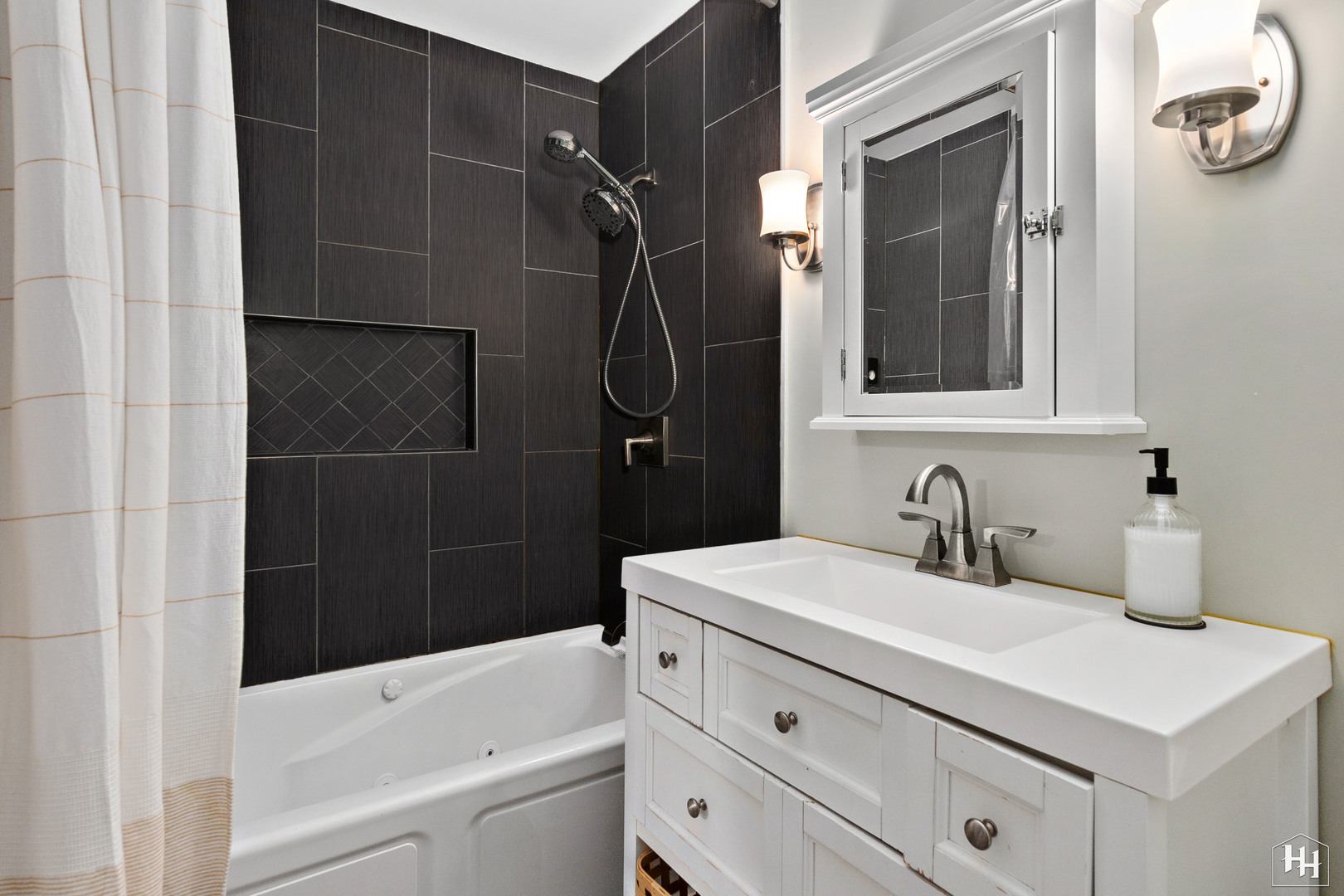 940 East Old Willow Road, Unit 206 Prospect Heights, IL 60070 - Photo 13 of 25 a bathroom with a sink a toilet and shower