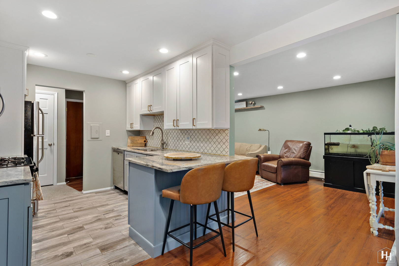 940 East Old Willow Road, Unit 206 Prospect Heights, IL 60070 - Photo 8 of 25 a kitchen with stainless steel appliances granite countertop a stove a sink a refrigerator and chairs