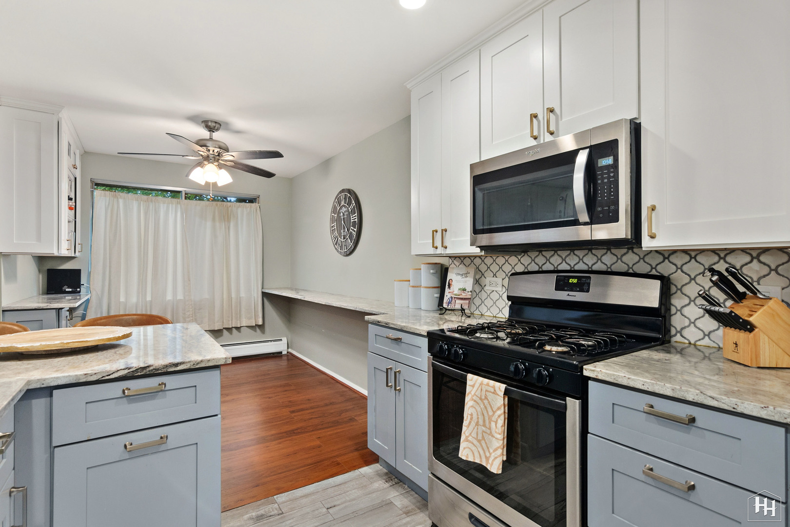 940 East Old Willow Road, Unit 206 Prospect Heights, IL 60070 - Photo 10 of 25 a kitchen with cabinets stainless steel appliances and a sink
