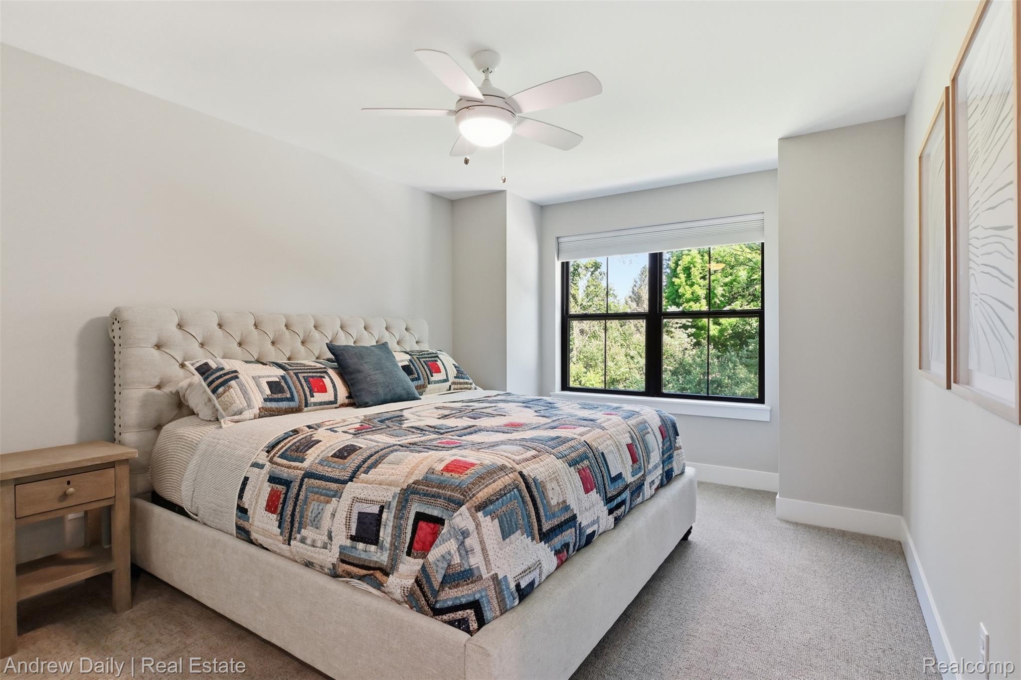 4661 Spears Road Pinckney, MI 48169 - Photo 27 of 56 Bedroom featuring light neutral wall paint, a large window with black framing, a ceiling fan with light fixture, light-colored carpeting, and white baseboards
