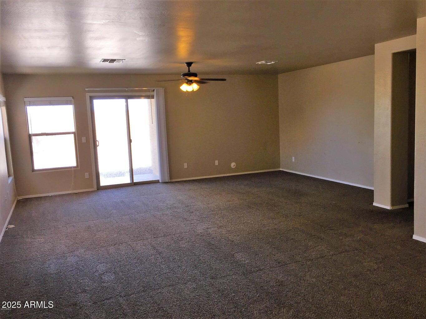 307 South Carter Ranch Road Coolidge, AZ 85128 - Photo 2 of 7 a view of an empty room with a window