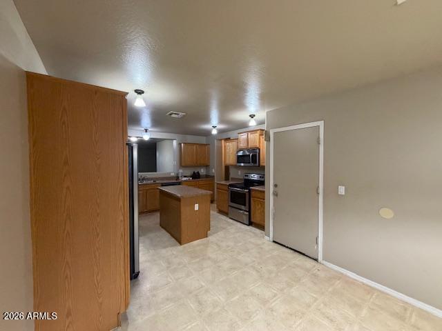 307 South Carter Ranch Road Coolidge, AZ 85128 - Photo 4 of 17 a view of kitchen with furniture and refrigerator