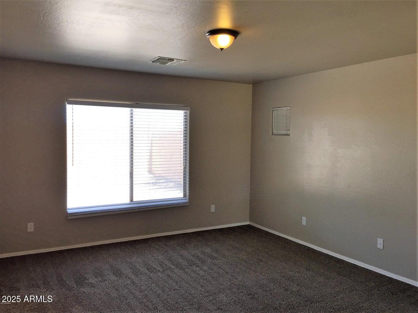 307 South Carter Ranch Road Coolidge, AZ 85128 - Photo 7 of 17 an empty room with a window