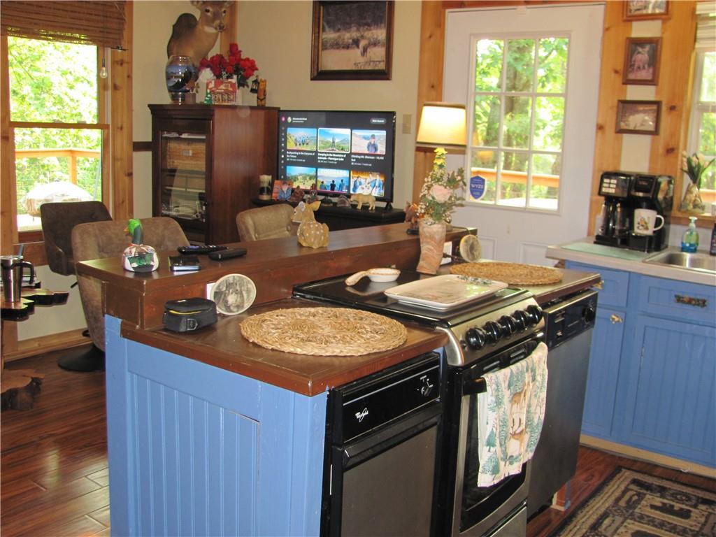 487 Angel Road Fairmount, GA 30139 - Photo 19 of 33 a view of a kitchen area with furniture and window