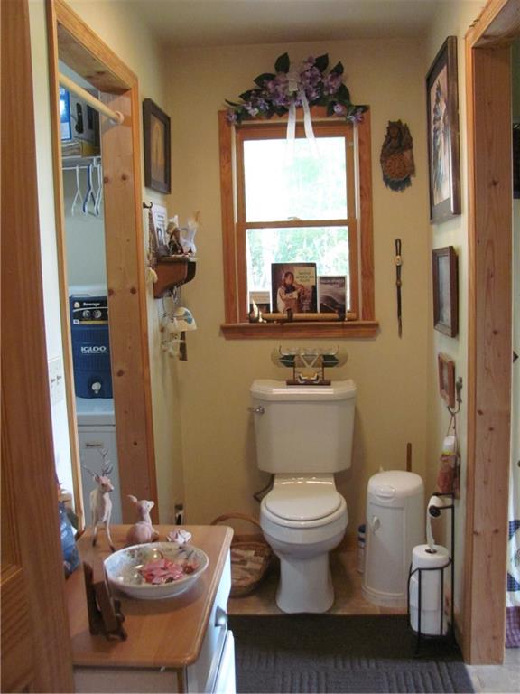 487 Angel Road Fairmount, GA 30139 - Photo 27 of 33 a bathroom with a toilet sink and mirror