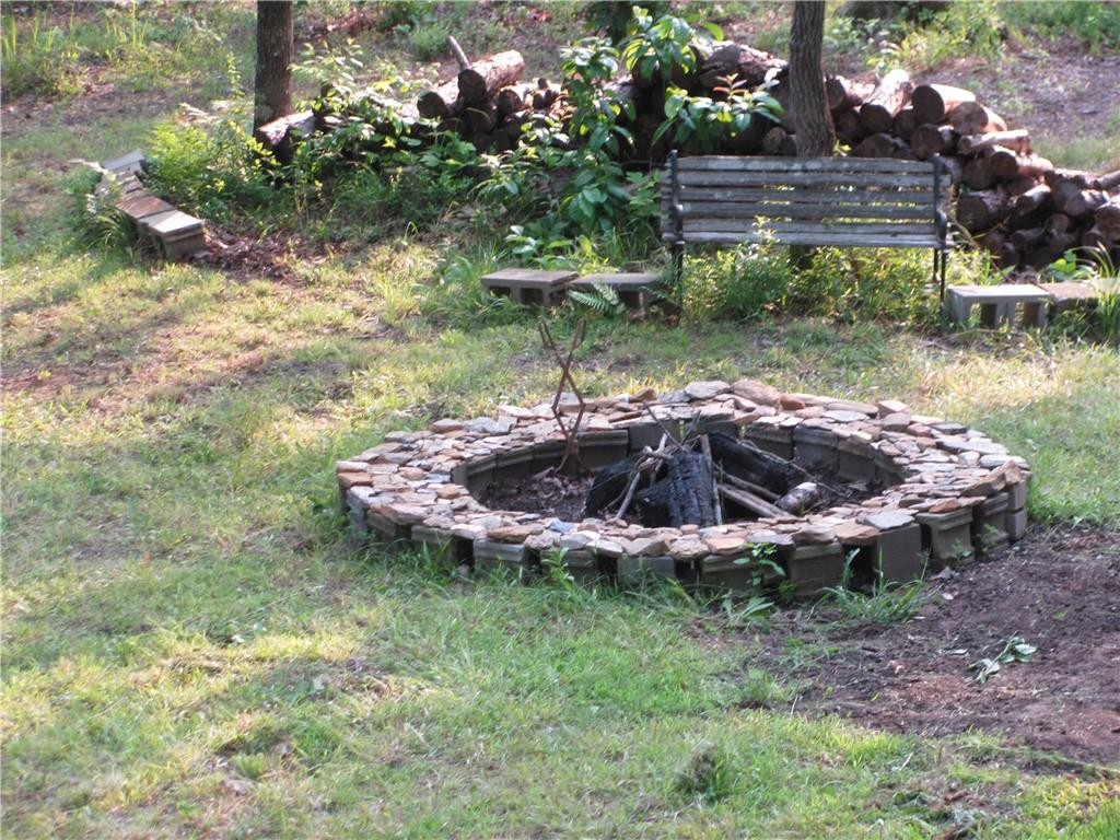 487 Angel Road Fairmount, GA 30139 - Photo 10 of 33 a view of a backyard with plants and outdoor seating