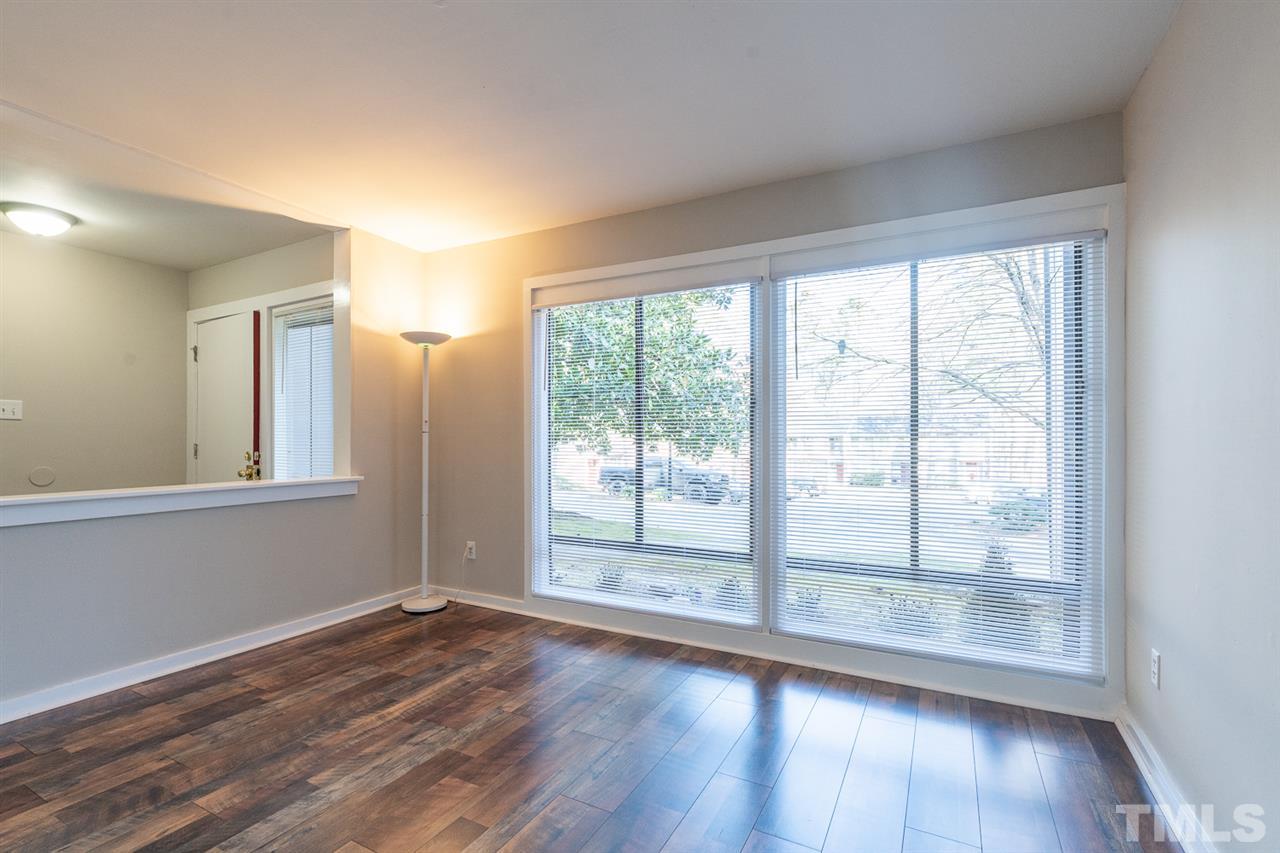 1762 Quail Ridge Road Raleigh, NC 27609 - Photo 3 of 28 a view of wooden floor and windows in a room