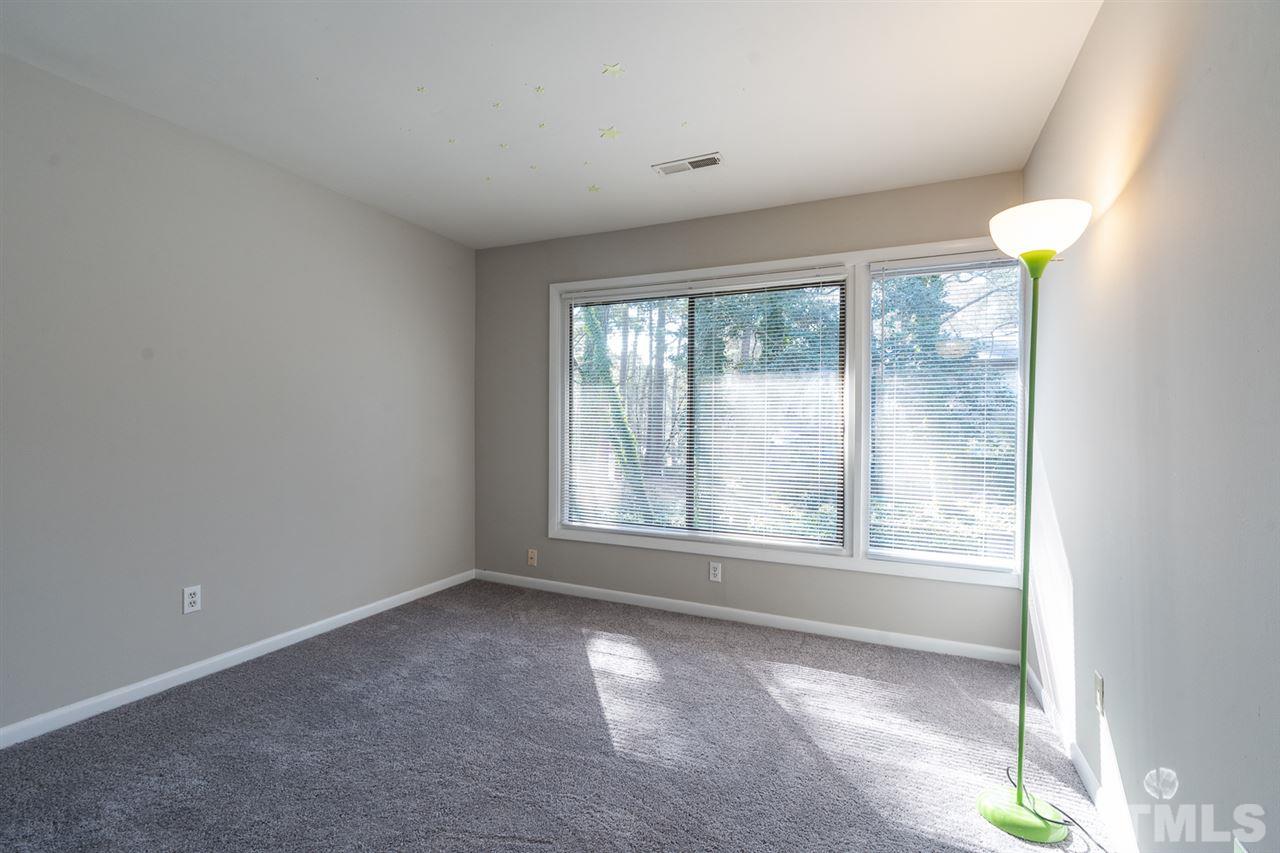 1762 Quail Ridge Road Raleigh, NC 27609 - Photo 22 of 28 an empty room with windows