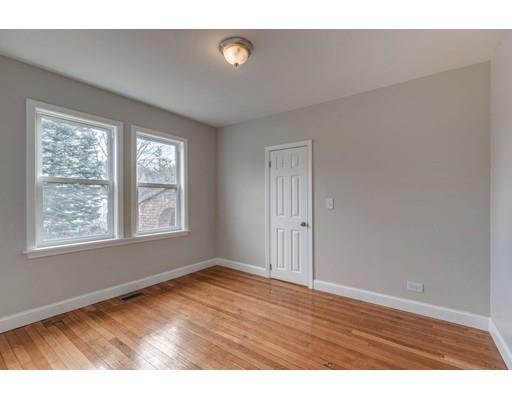 334 Salem Road Billerica, MA 01821 - Photo 17 of 30 a view of an empty room with wooden floor and a window